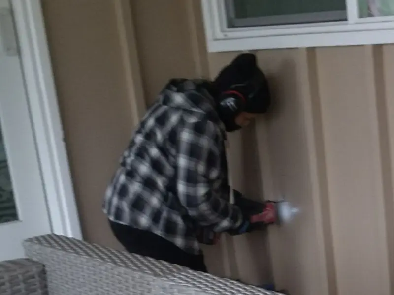 Professional electrician installing an exterior outlet in Athens